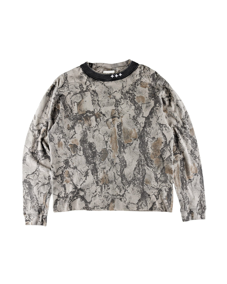 Gray and brown camouflage long-sleeve knit shirt with a black crew neck and three white stars on a white background.