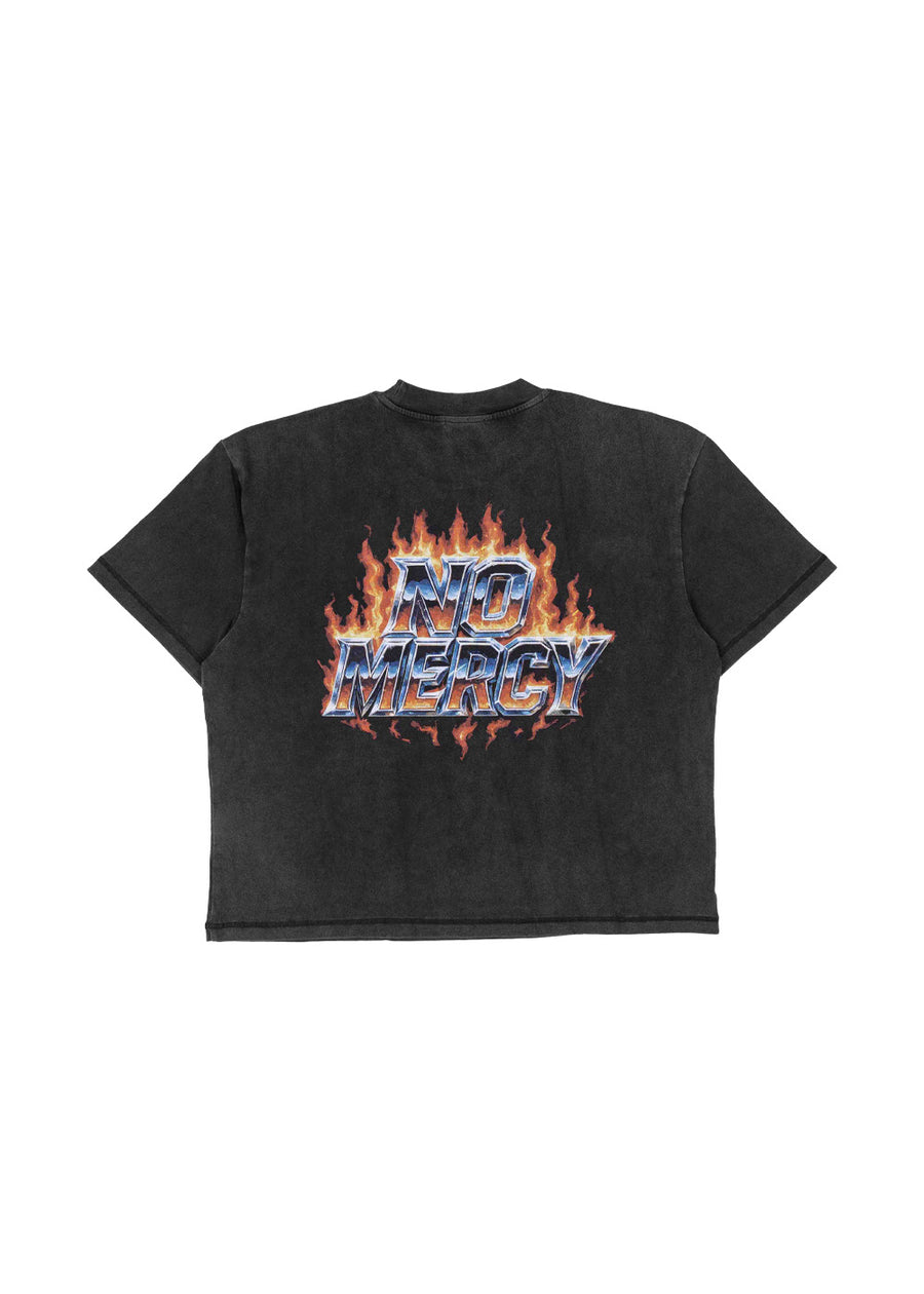 Washed black short-sleeve T-shirt with metallic-style NO MERCY lettering and orange flames on a white background.