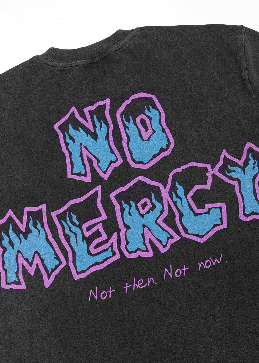 Black crewneck T-shirt with blue flame-filled NO MERCY lettering outlined in purple, laid flat on white.