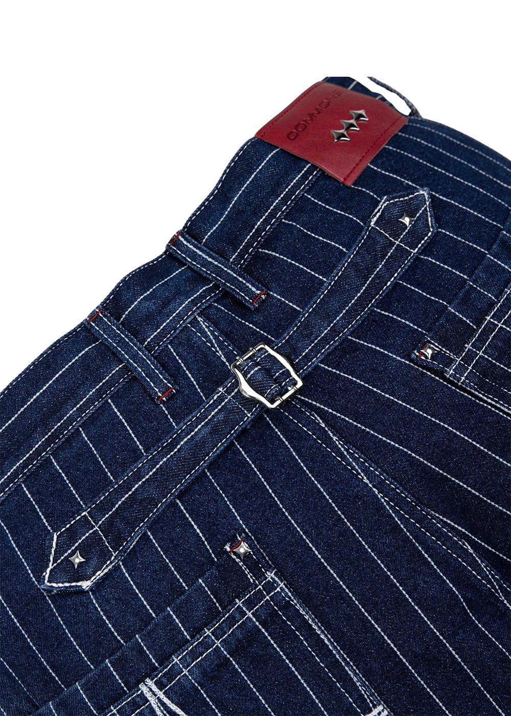 Navy pinstriped denim pants with a silver back buckle, star-shaped studs, belt loops, and a red waistband patch.
