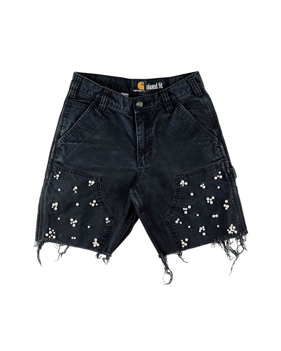 Black denim shorts with white pearl embellishments, frayed hems, belt loops, and front pockets on a white background.