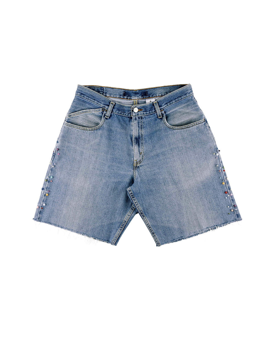 Light blue denim shorts with raw hems, front pockets, belt loops, and multicolored beads along the side seams.