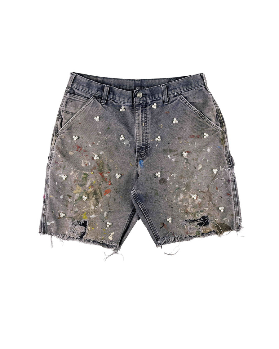 Gray denim shorts with pearl-like bead clusters, multicolored paint splatters, ripped patches, and frayed hems.
