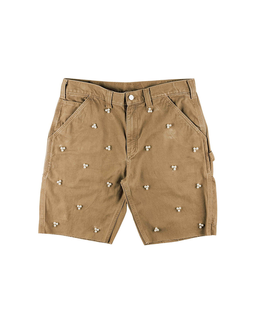 Tan twill shorts with pearl-like bead clusters, slanted pockets, belt loops and raw hems on a white background.