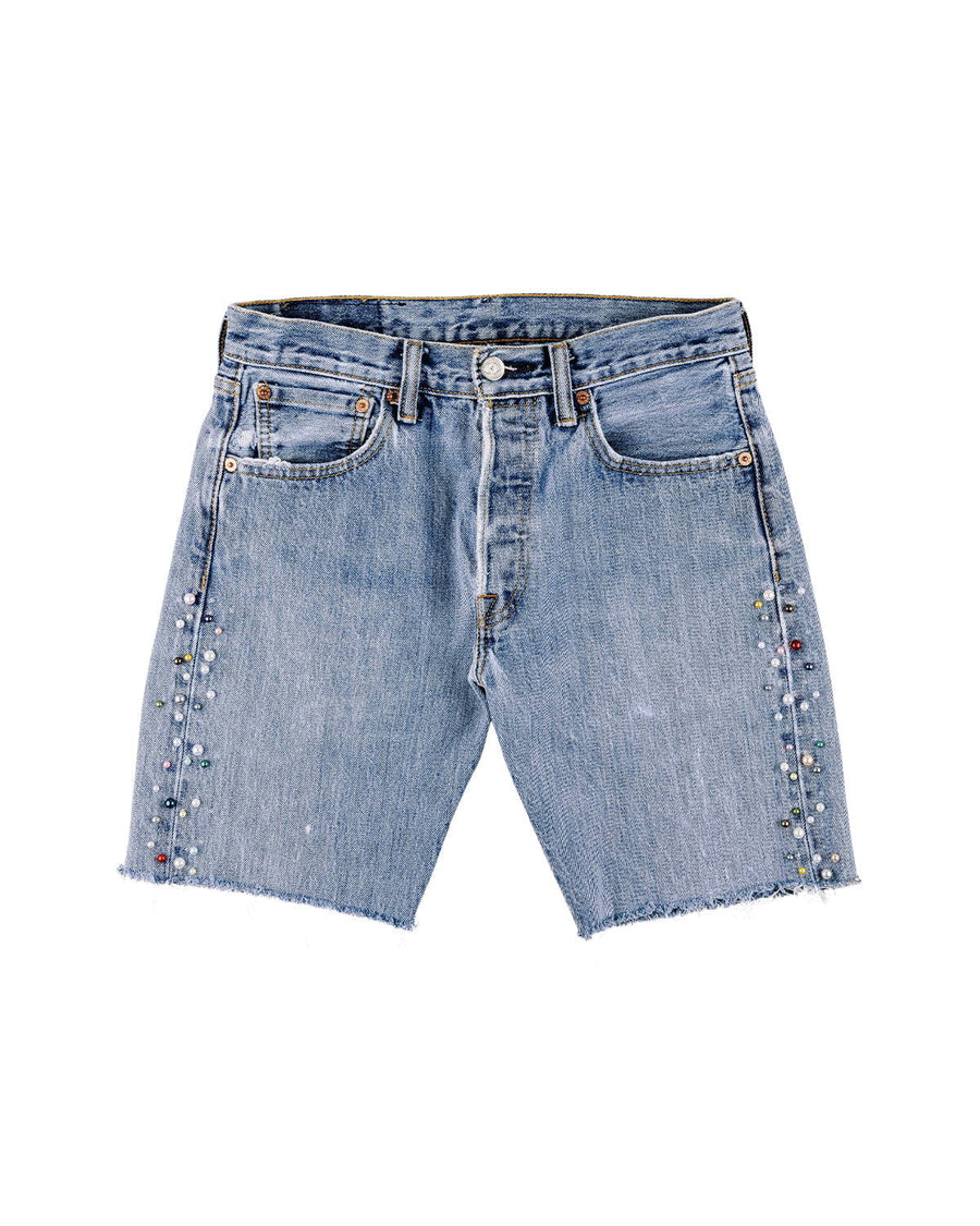 Light blue denim shorts with frayed hems, front pockets, and multicolored bead embellishments along the sides.