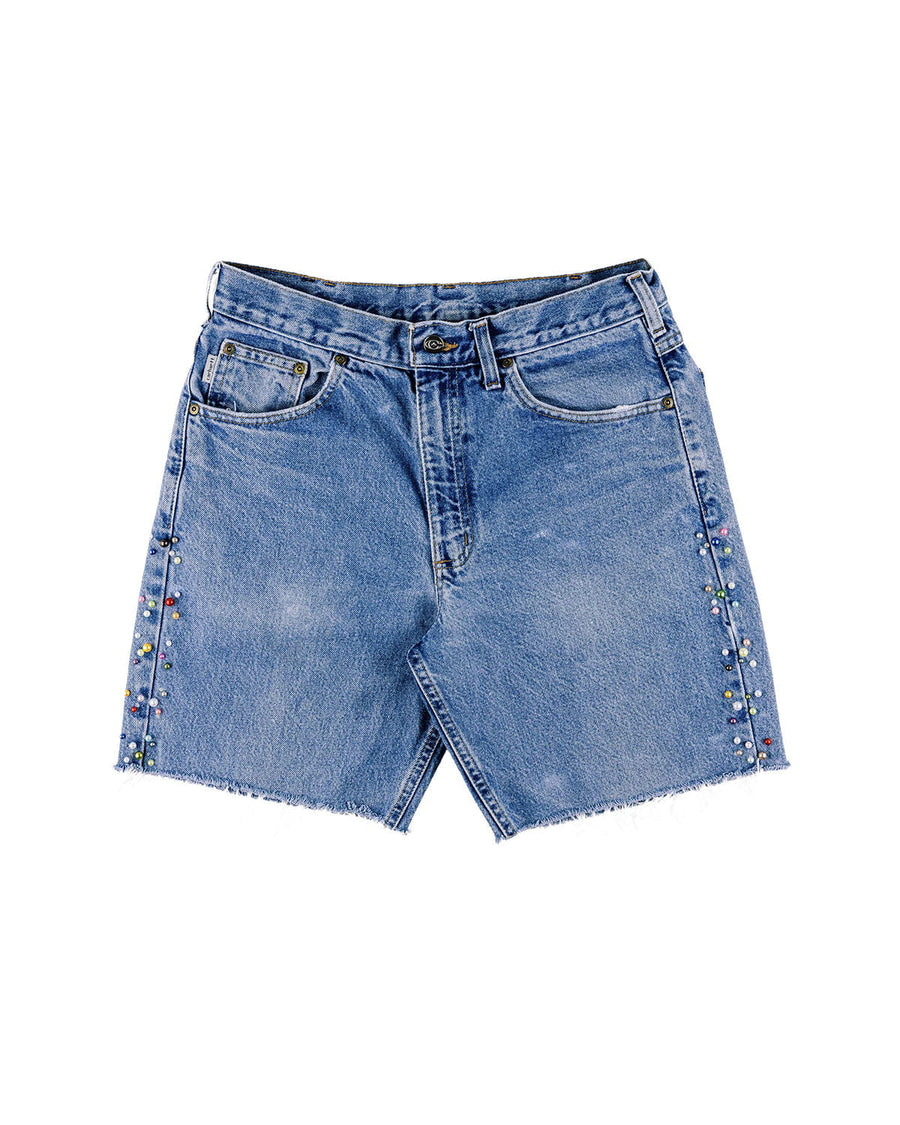 Blue denim shorts with frayed hems, front pockets, belt loops, and multicolored bead embellishments along the sides.