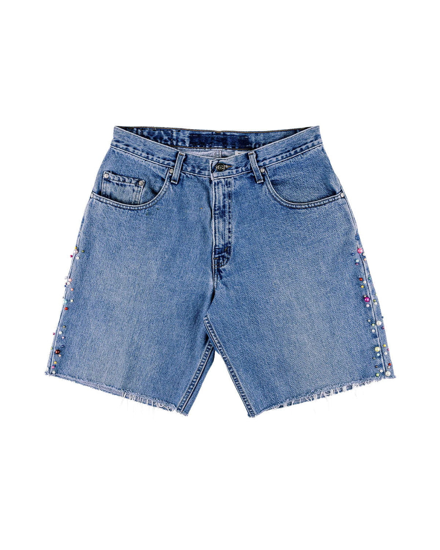 Blue denim shorts with frayed hems, front pockets, belt loops, and multicolored beads along the side seams.